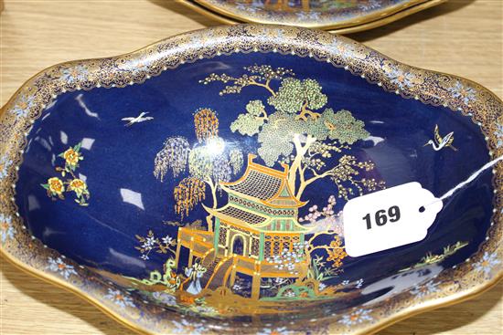 A Carltonware thirty five piece coffee and dessert service, with chinoiserie decoration on a dark blue ground